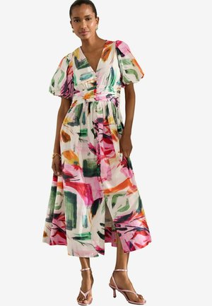 Floral midi dress with vibrant abstract patterns in pink, green, and orange. Short puff sleeves, fitted waist, and thigh-high slit detail.