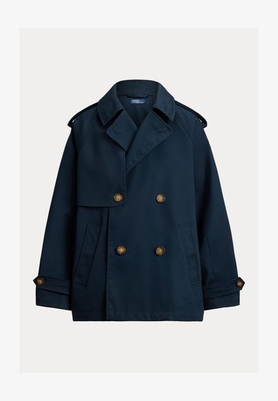 Σκούρο μπλε διπλής σειράς παλτό τύπου pea coat με φαρδιές πέτρες για το πέτο, επιλαιμούς στους ώμους, μανσέτες με κουμπιά και πλαϊνές τσέπες.