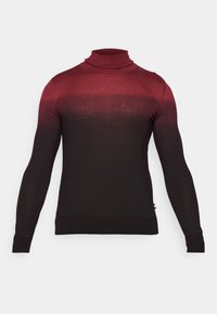 Pull à col roulé avec un dégradé de rouge vers noir, en tissu tricoté. Comprend des manches longues et une silhouette ajustée.