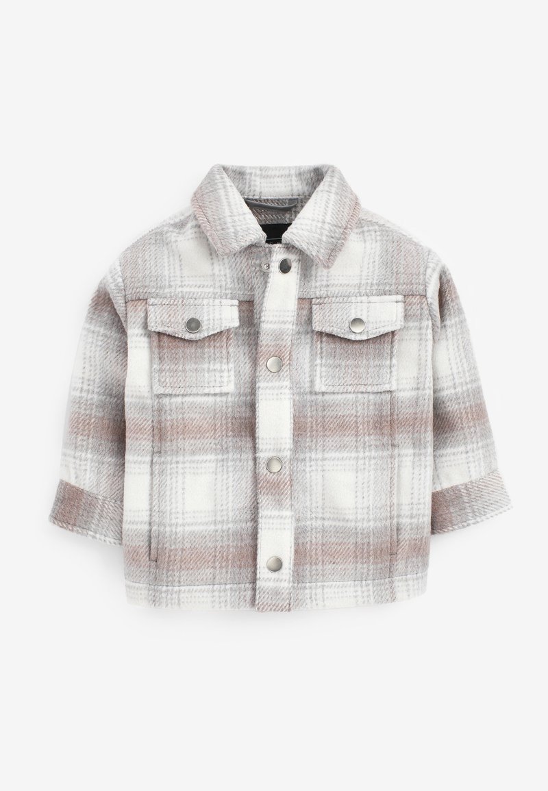 Veste à carreaux pour enfants en beige, blanc et marron clair avec manches longues, boutons-pression devant et deux poches poitrine à rabat.