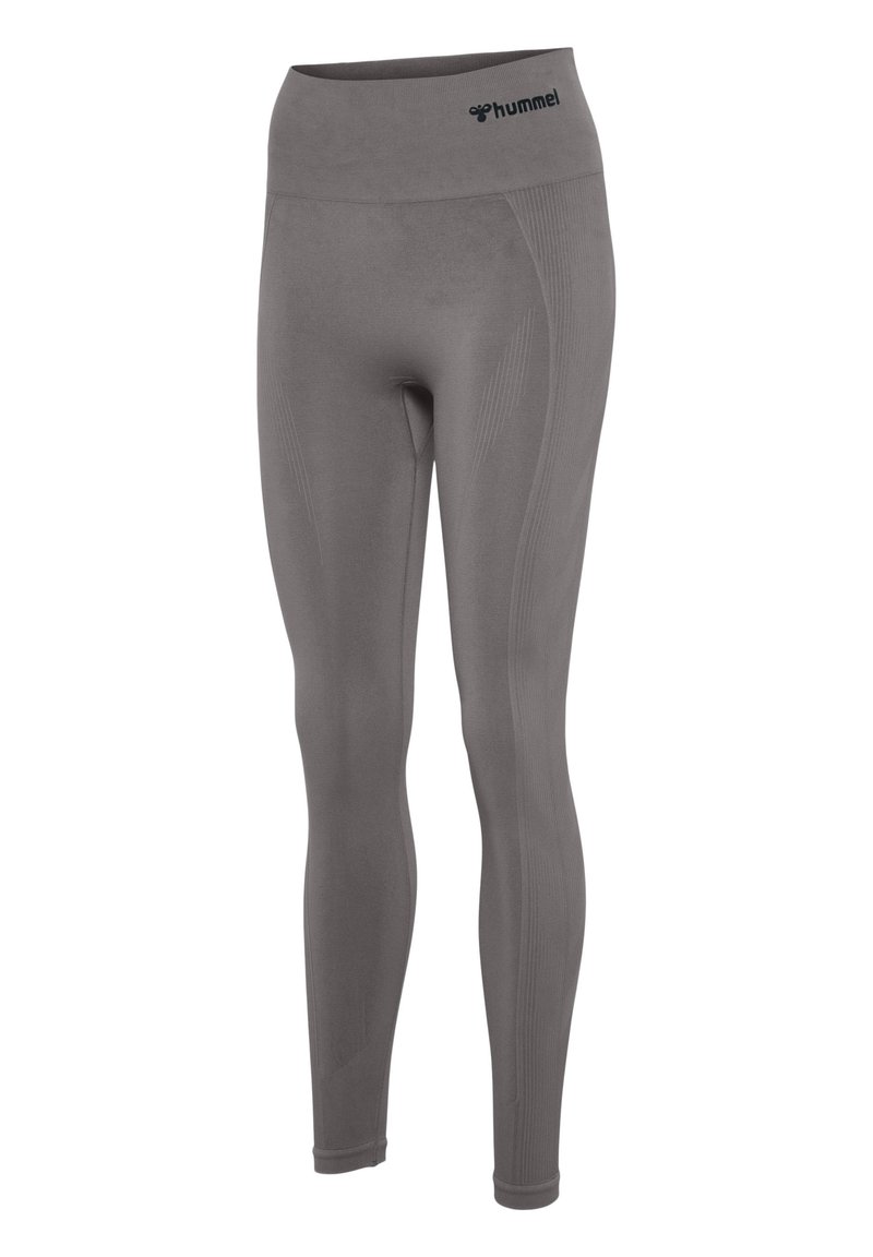 Grijze leggings met een hoge tailleband. Gemaakt van rekbaar materiaal, met gestructureerde zijkanten en een logo nabij de tailleband.