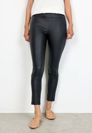 Leggings noirs ajustés en matériau brillant et extensible. Longueur cheville avec une texture lisse et une large ceinture confortable.