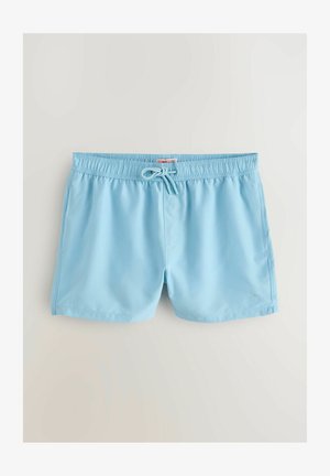 Šviesiai mėlynos maudymosi šortai su elastinga juosta ir reguliuojama raišteliu. Lygi medžiaga ir mažas palmių medžio logotipas šone.