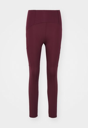 Maroon leggings made of stretchy material, featuring a high waistband and flat seams. They have a fitted design and smooth texture.