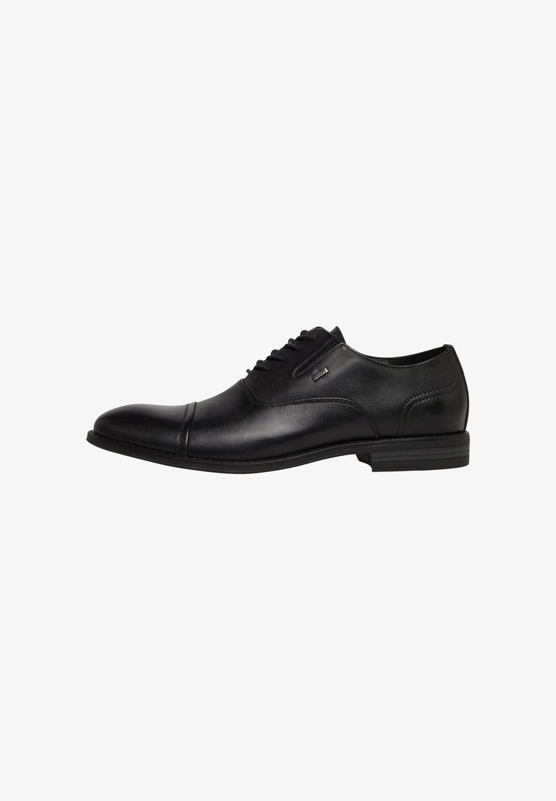 Black leather men's formal Oxford shoe with lace-up closure and low stacked heel, side stitching, and cap toe detailing.