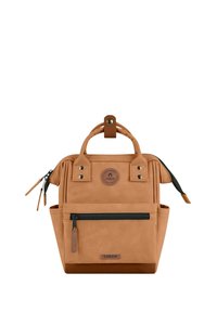 Tan backpack made of durable fabric, featuring dual top handles, a front zip pocket, and a round logo patch. Minimalistic design with accents.