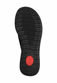 Zwarte schoenenzool met een gestructureerde rubberen grip, voorzien van een rode cirkelvormige accent en een driehoekig detail met maat 37 label.