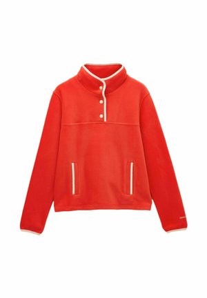 Red fleece pullover with high collar, three white snap buttons, two front pockets, and white trim on collar and pocket edges.