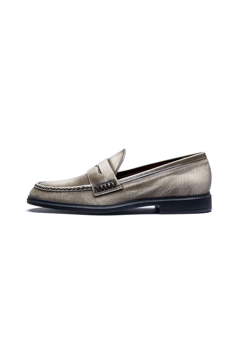 Metallic silver leather loafer with a rounded toe, decorative stitching, and a textured strap across the vamp. Black rubber sole.