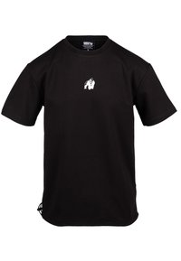 Juodas medvilnės t-shirt su trumpomis rankovėmis ir apvaliu kaklu. Priekyje yra baltas gorilos grafikas ir reguliuojami šoniniai siūlės.