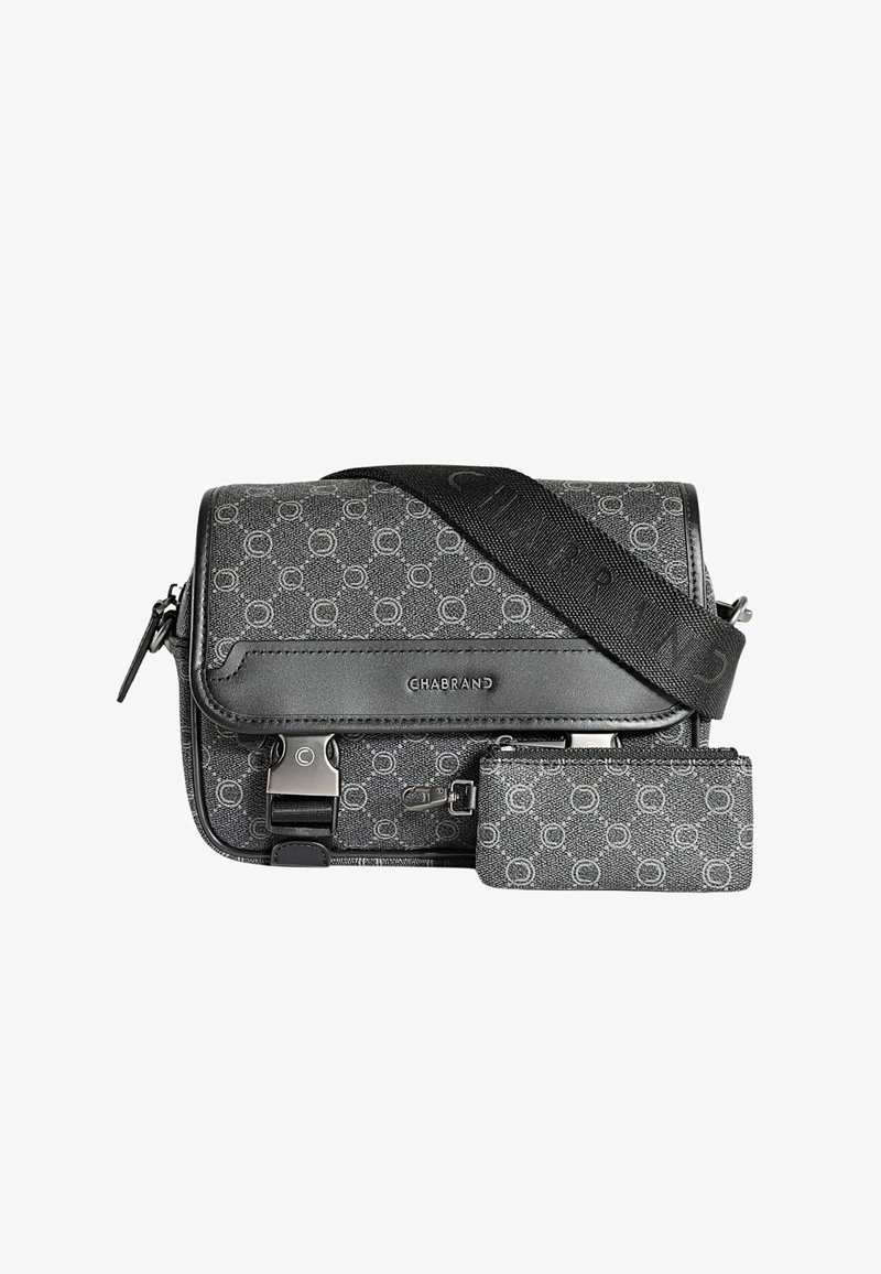Sac bandoulière noir et gris avec un tissu à motifs, des accents en cuir, des accessoires en métal, une sangle ajustable et une petite pochette assortie.