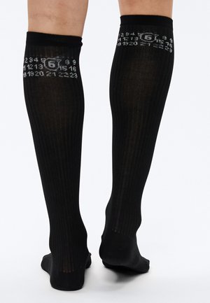 BOOTLEG - Kniekousen - black