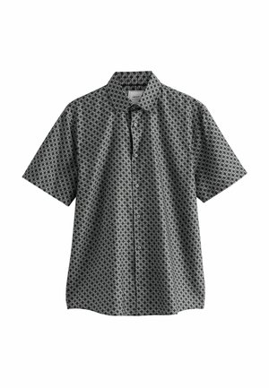 Kratka majica na dugme s kratkim rukavima u crnoj i bijeloj boji s geometrijskim uzorkom, s ovratnikom koji se preklapa i opuštenim krojem. Pamučna tkanina.