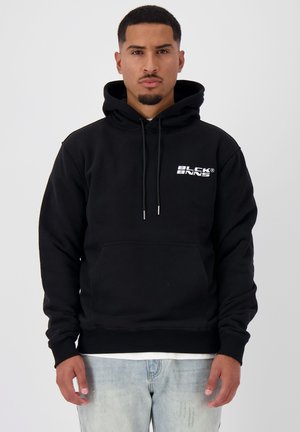 Black hoodie made of soft fabric, featuring a kangaroo pocket, white logo print on the chest, and drawstrings on the hood.