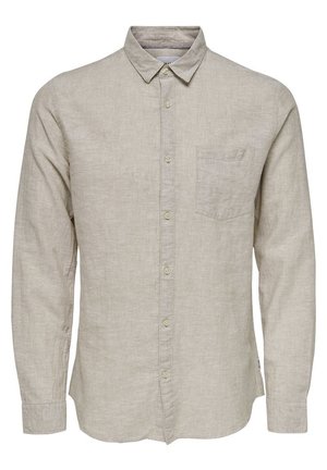 Chemise à manches longues beige clair en lin, avec un col, une poche poitrine unique et une texture subtile.