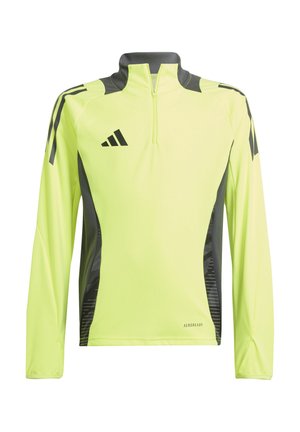 Langarm sporttop in felgeel met een kwart rits. Kenmerkend zijn de donkergrijze accenten en een geometrisch patroon aan de zijkanten, gemaakt van vochtafdrijvend materiaal.