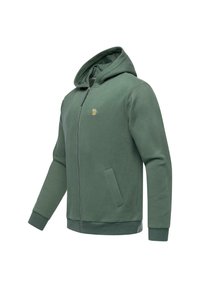 Felpa verde con zip realizzata in tessuto morbido, dotata di un cappuccio, tasche frontali e un piccolo dettaglio ricamato sul petto.