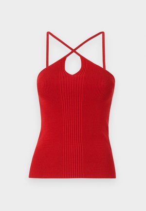 Top halter rojo acanalado con un corte de ojal, finas tirantes cruzados en la espalda y un corte ajustado. Hecho de un material de punto elástico.