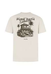 Licht beige katoenen t-shirt met een grafische print van een huis met palmbomen. De tekst luidt "Pure Path Getaway" en heeft een casual ontwerp.