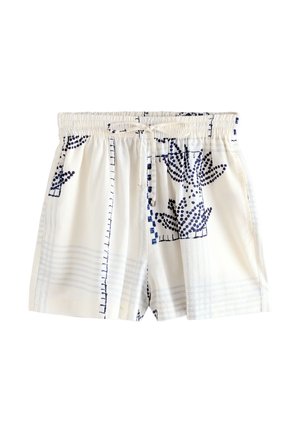 Hvide shorts i stof med blå kaktusmønstre, elastisk talje og snørrelukning foran.