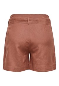 Shorts en lin de couleur rouille avec une texture lisse, dotés d'une taille élastique et de deux poches arrière. Coupe droite et bords ourlés.