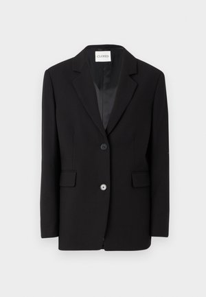 Zwarte op maat gemaakte blazer met een geknipt revers, sluiting met één knop en twee voorkiezen. Glad fabric met een gestructureerde pasvorm.