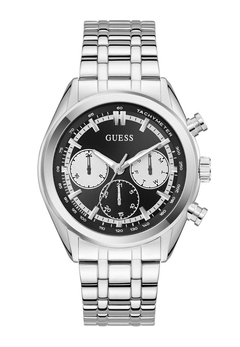 Montre Guess en métal argenté avec cadran noir, trois sous-cadrans pour l'heure sur 24 heures, le jour et les secondes, et une échelle tachymétrique sur la lunette.