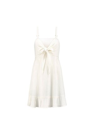 Vestido de algodón blanco con tirantes ajustables, que presenta un lazo en la parte delantera y un dobladillo con volantes, tejido texturizado con un diseño ligero.