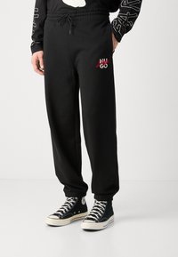 HUGO DLOGOPANTE - Spodnji deli trenirk - black