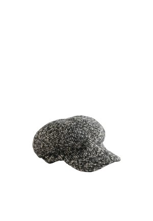 Casquette plate en tweed noir et blanc en laine avec une courte visière, un tissu à texture douce et une couronne légèrement gonflée.