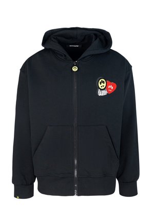 Felpa nera con zip realizzata in cotone, dotata di tasca frontale, con un bottone a forma di sorriso giallo e grafiche ricamate di un faccino sorridente e un cuore rosso.