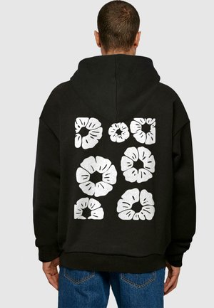 Felpa nera con cappuccio caratterizzata da un design sul retro con otto forme floreali argentate, vestibilità ampia e polsi e orlo a costine.