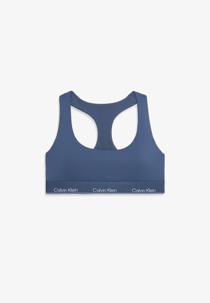 Tumši zila sporta krūšturis ar sacensību aizmuguri, izgatavots no gludas auduma. Iekļauj stabilu elastīgu joslu apakšā ar zīmola logo.