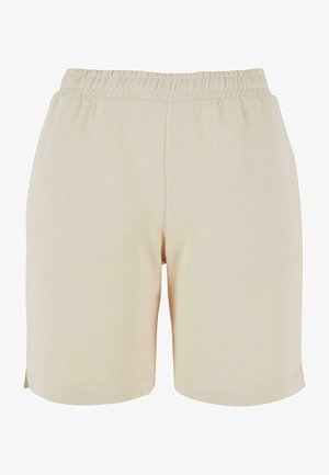 Beżowe bawełniane szorty z elastycznym pasem, gładką fakturą, do kolan, z bocznymi rozcięciami na dole dla zwiększonej swobody ruchów.
