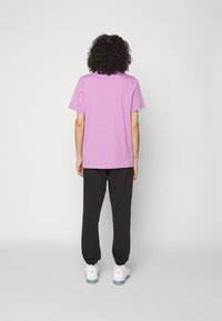 Nike Sportswear M NK CLUB+ FT CF PANT LBR - Träningsbyxor - black