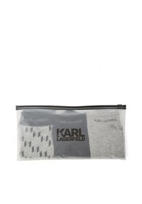 Set of three socks in a clear zippered pouch; includes two solid black and one gray sock with a geometric pattern and logo detail.