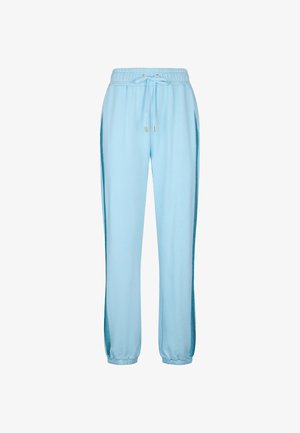 Pantaloni da tuta azzurri chiari in tessuto morbido, con vita elastica e coulisse, pannelli laterali in rete e polsini aderenti alle caviglie.