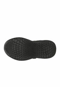 Suola di scarpa in gomma nera con un motivo a nido d'ape, forma piatta e superficie liscia, progettata per aderire e garantire stabilità.