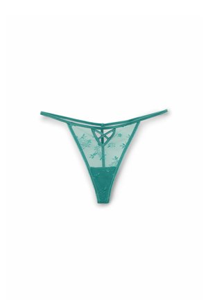 String en dentelle turquoise avec motif floral et tissu en mesh. Présente des bretelles fines et un détail central découpé à l'avant.