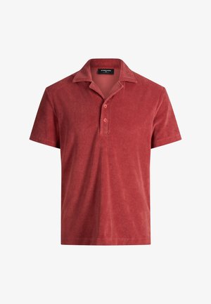 Kurzärmliges Polohemd aus Frottee in rostrot mit einer Zweiknopfblende und einem ausgestellten Kragen.
