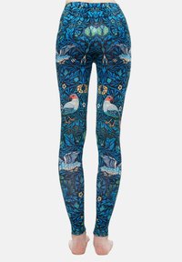 Sötétkék virágmintás szövet leggings, élénk színekben megjelenő madarakkal és virágokkal, testhezálló fazonban, bokáig érő vágással.