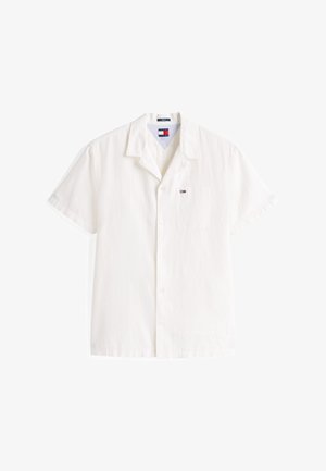 Rövid ujjú, fehér pamut ing, gallérral, elülső zsebbel és egy kis logóval a mellkason. Simaszerkezet, lazább szabással.