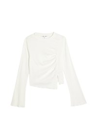 Top bianco a maniche lunghe con tessuto testurizzato, design cropped, dettaglio arricciato ai lati e svasatura alle maniche.
