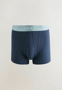 Boxer blu navy con elastico in vita azzurro chiaro con il logo "NEXT" e design aderente con tasca frontale per il supporto.