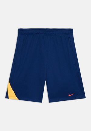 Shorts Nike de couleur bleu foncé, avec une accentuation jaune sur le côté gauche, une taille élastique et une texture subtile. Logo orange en bas à droite.
