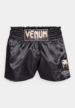 Črne satenske kratke hlače z nabranim pasom, ki imajo zlati logotip "VENUM" in detajle na levi nogi. Gladka tekstura, športna zasnova.
