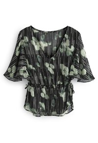 Blouse noire à col V avec des manches flottantes, motif floral abstrait vert, rayures verticales argentées et cordon de serrage à la taille.