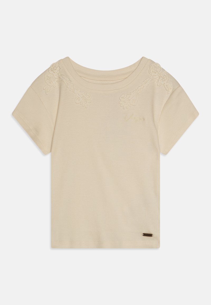 Lühikeste varrukatega beež T-särk, ribakangas, millel on lilleline broderie õlgadel ja väike brändi silt alumisel serval. Sujuv tekstuur.