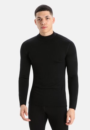 Zwart lange mouwen turtleneck shirt gemaakt van rekbaar materiaal, met een getailleerd ontwerp, een soepele textuur en minimale naden.