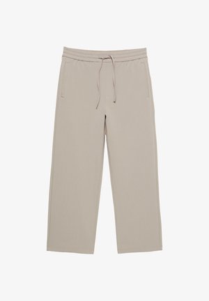 Beige sportbroek met een elastische tailleband, trekkoord, twee zijzakken, recht gesneden pijpen en een zachte textuur.